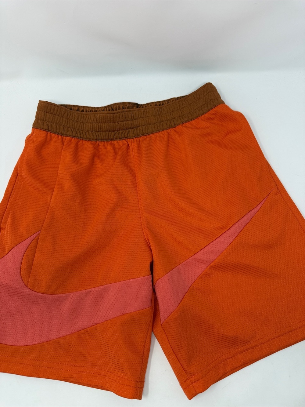 Kid’s Nike Orange Athletic Shorts with Pink Swoosh and pockets. Size M Dri-fit